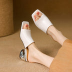 Virelle Curve Leder Mules mit Absatz