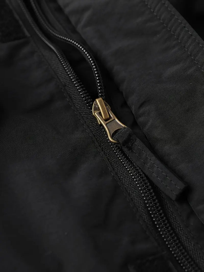 Evra | 2-in-1 Windjacke mit integrierten Handwärmern